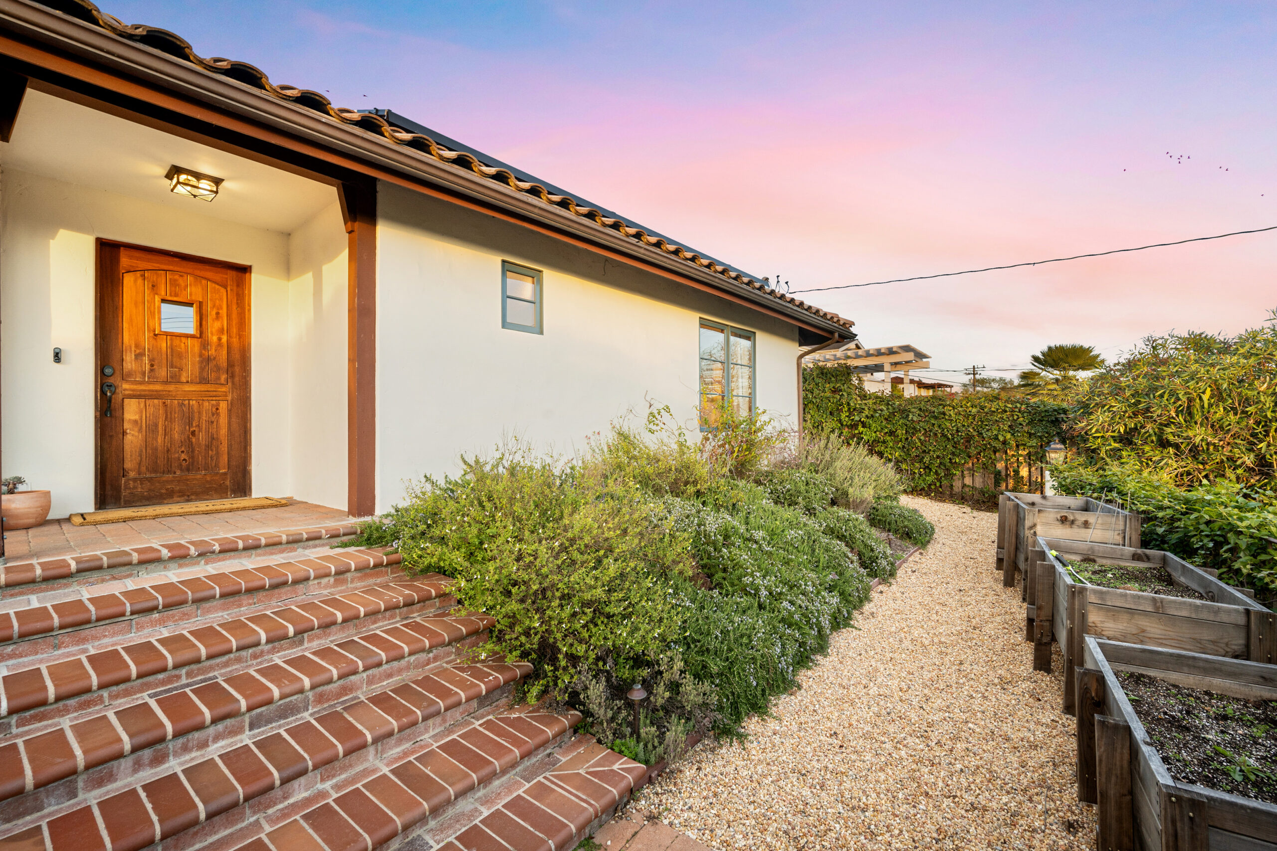 Steps leading up to a front door with an attached patio